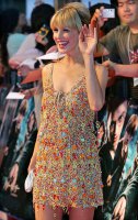 She's waving her hand at us, I'm waving my wand at her. What!?! It is a Harry Potter event! ;-) harry_potter_japan_78