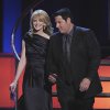 At least he's helping the lady down the stairs peoples_choice_awards_onstage_006